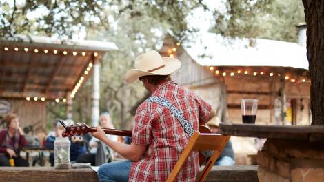 Playing an intimate backyard country concert in San Antonio, Texas