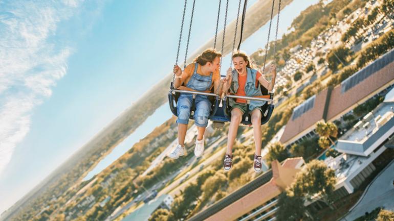 Soaring to dizzying heights on the StarFlyer swing ride at ICON Park