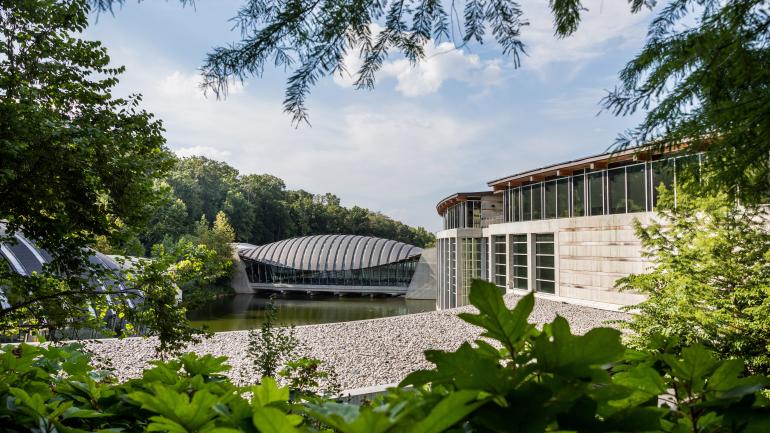 The intriguing exterior of Crystal Bridges Museum of American Art tucked into the surrounding forest
