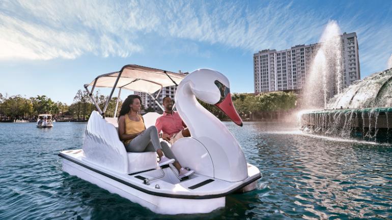 Pedaling a swan boat around Lake Eola in the core of Downtown Orlando