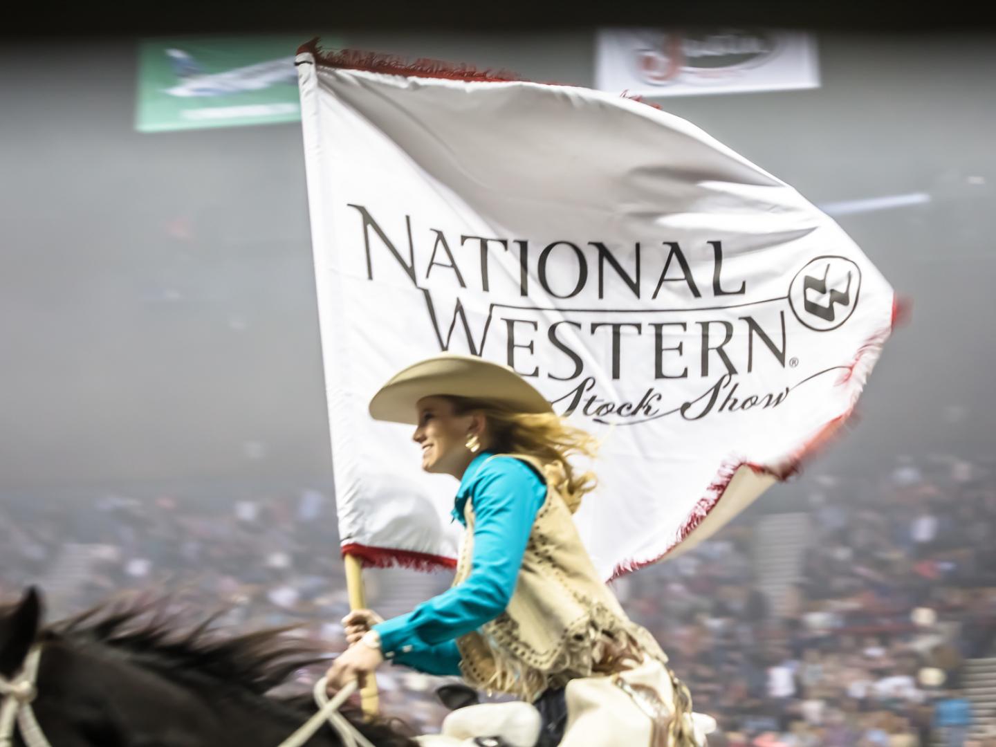 Riding with the banner for Denver’s National Western Stock Show & Rodeo