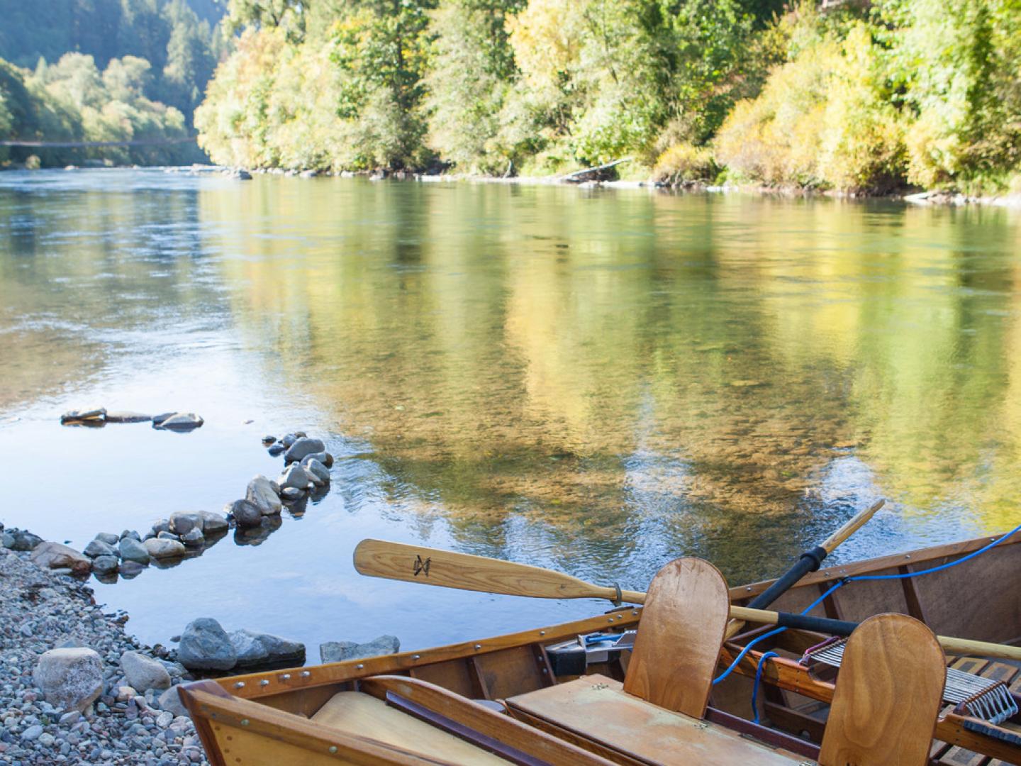 A wooden drift boat on the McKenzie River in Vida