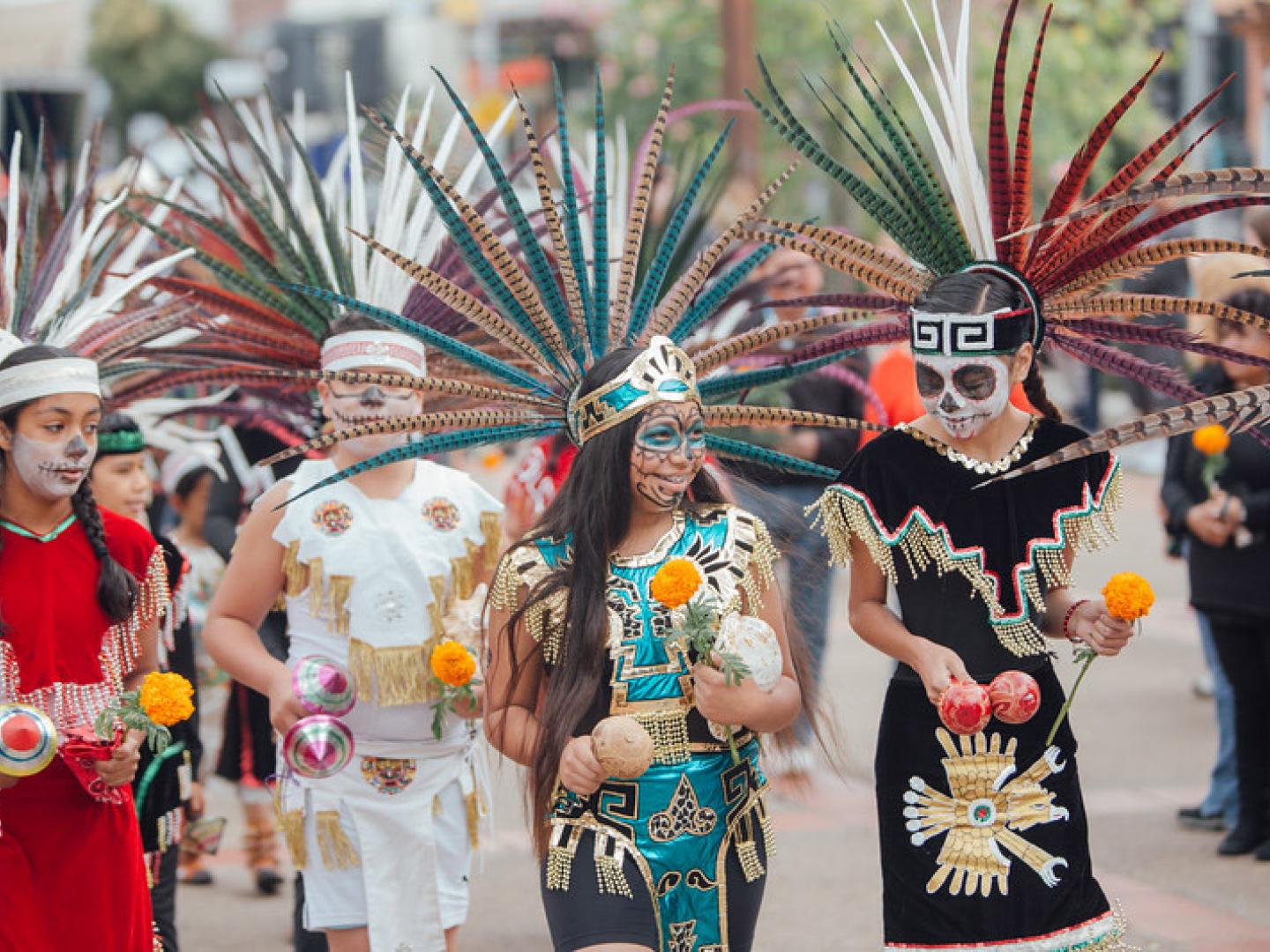 Costumed participants in the Dia de Los Muertos San Luis Obispo parade
