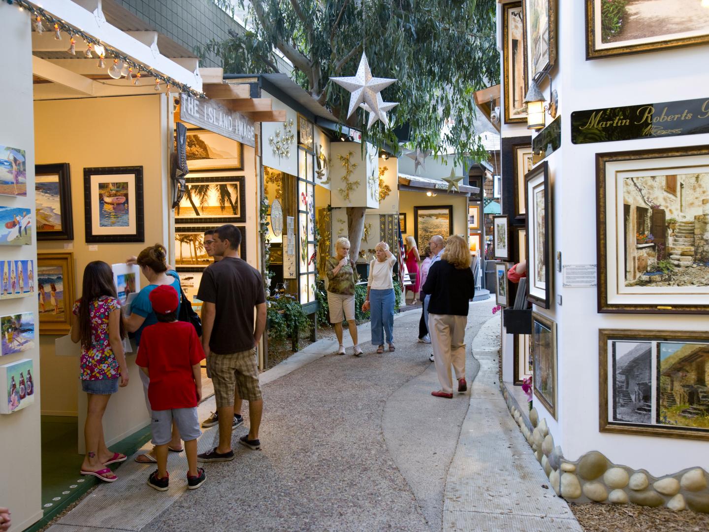 Browsing art booths during the Sawdust Art & Craft Festival in Laguna Beach, California