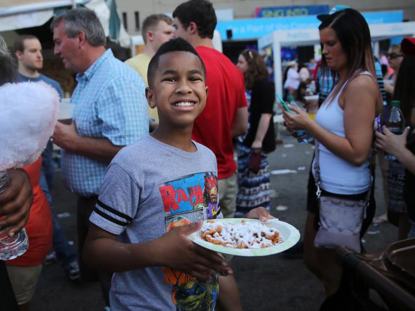 Child enjoying the tasty eats and almost endless options at Ohio’s Taste of Cincinnati