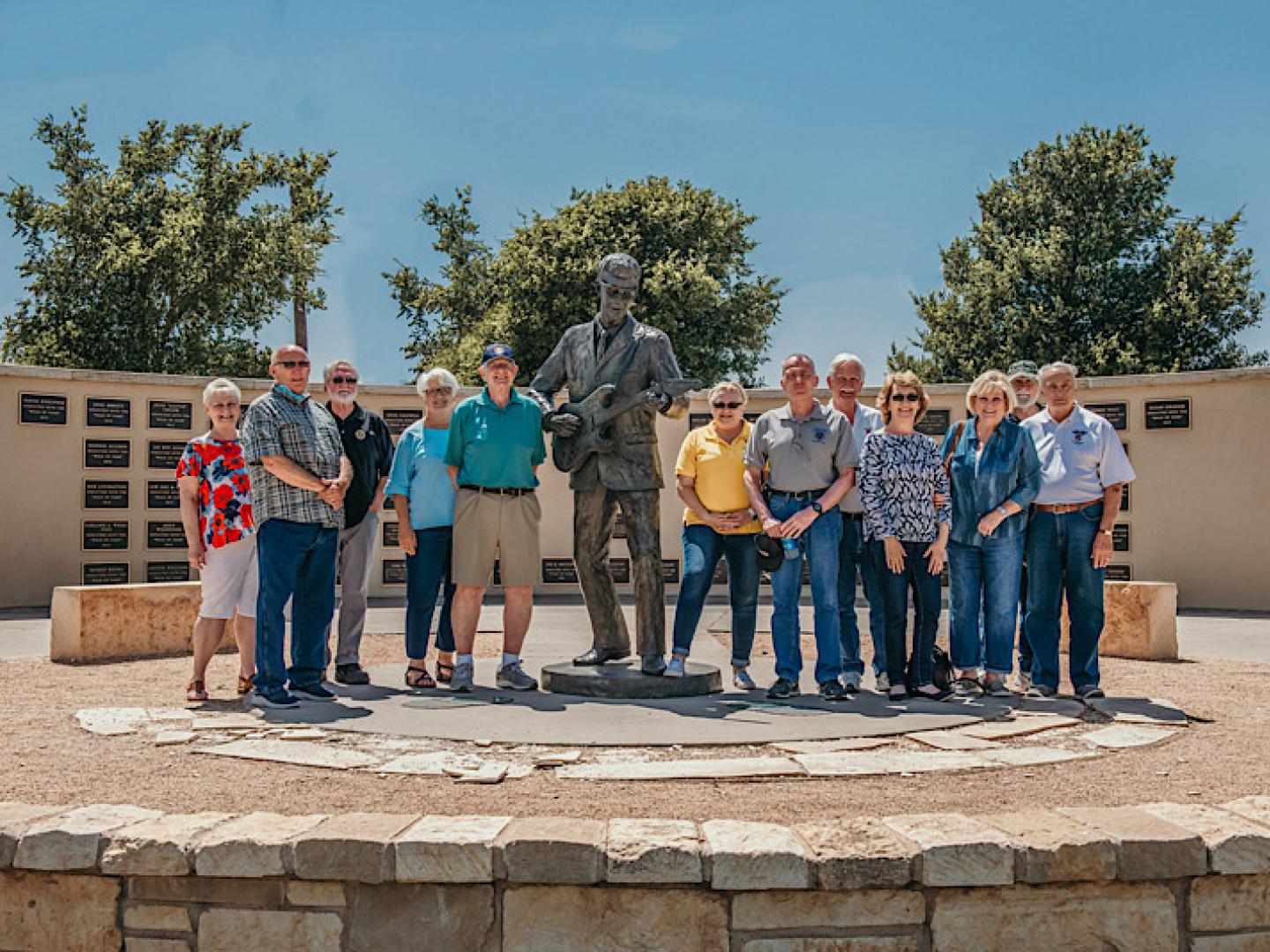 Posing with a statue of Buddy Holly at the Buddy Holly Center in Lubbock, Texas