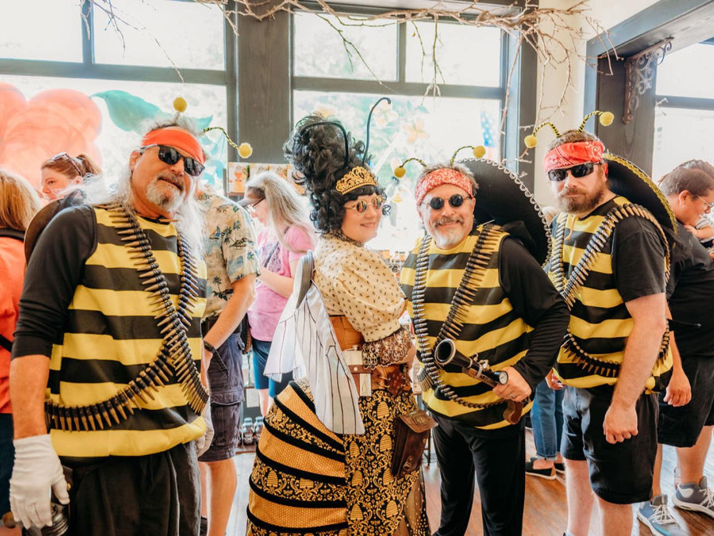 Festivalgoers dressed in bee costumes at the Honey Festival & Market in Ste. Geneviève, Missouri