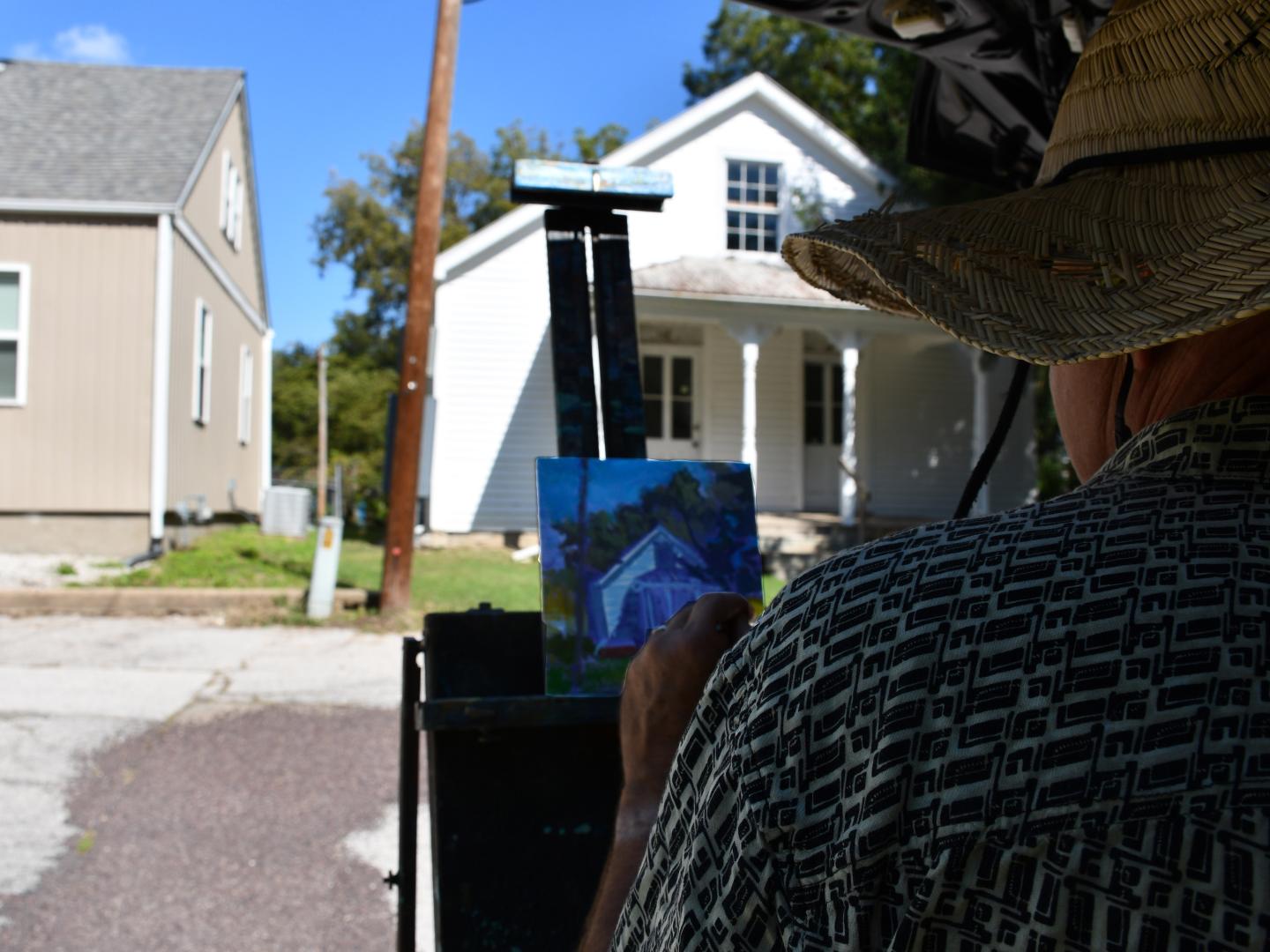 An artist paints during the annual Plein Air Painting Event in Ste. Geneviève, Missouri