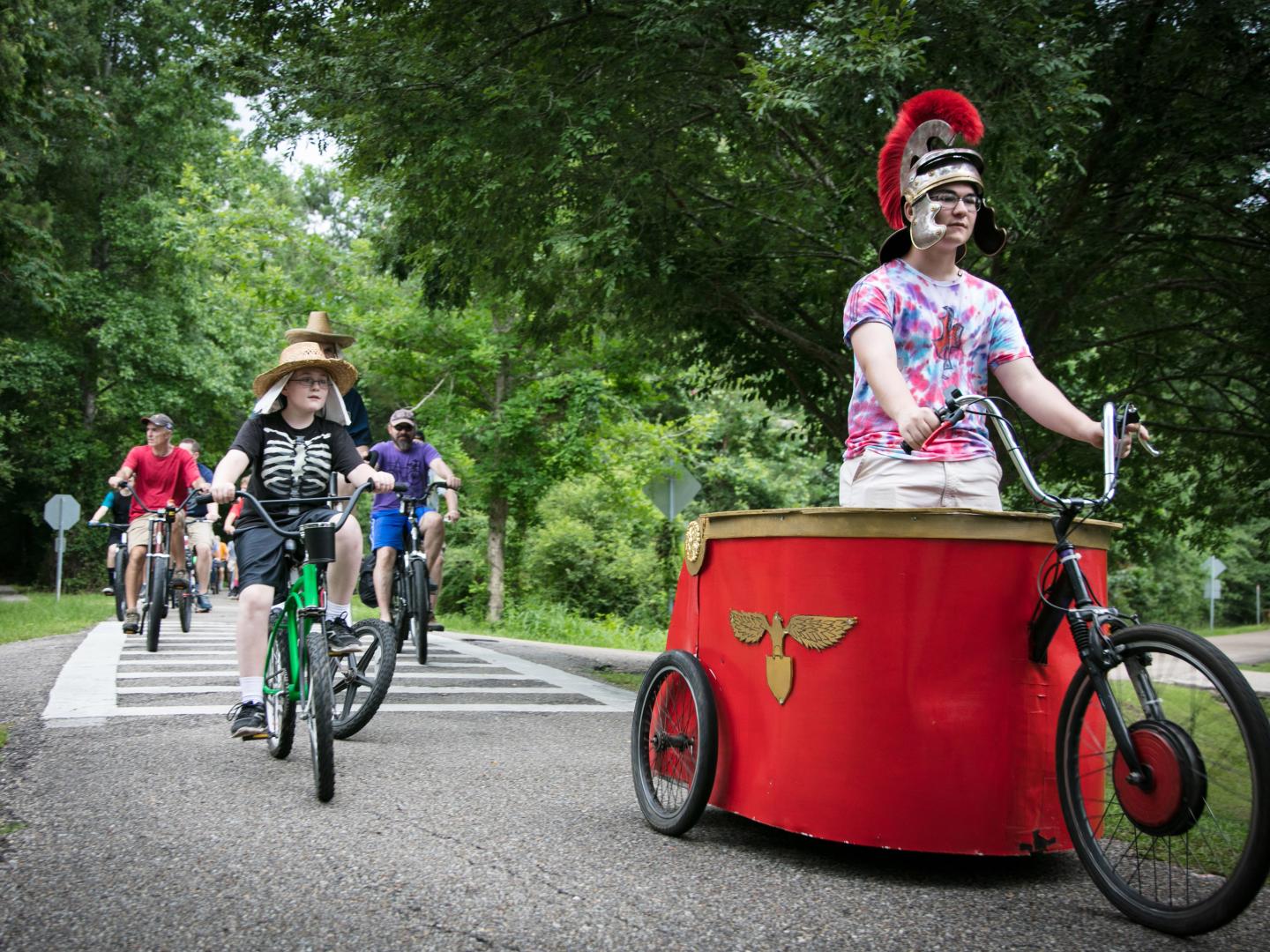 Costumed cyclists celebrate the Louisiana Bicycle Festival in Abita Springs, Louisiana