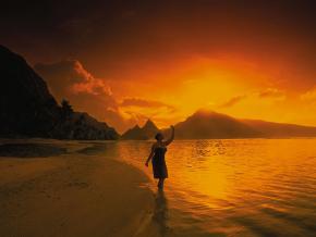 Rising sun over the mountains and coastline of the Manu'a Islands Rising sun over the mountains and coastline of the Manu'a Islands