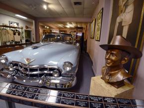 A bust of the Country musician and his blue Cadillac at the Hank Williams Museum A bust of the Country musician and his blue Cadillac at the Hank Williams Museum