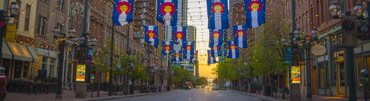 Colorado state flags hung over Larimer Square in Denver