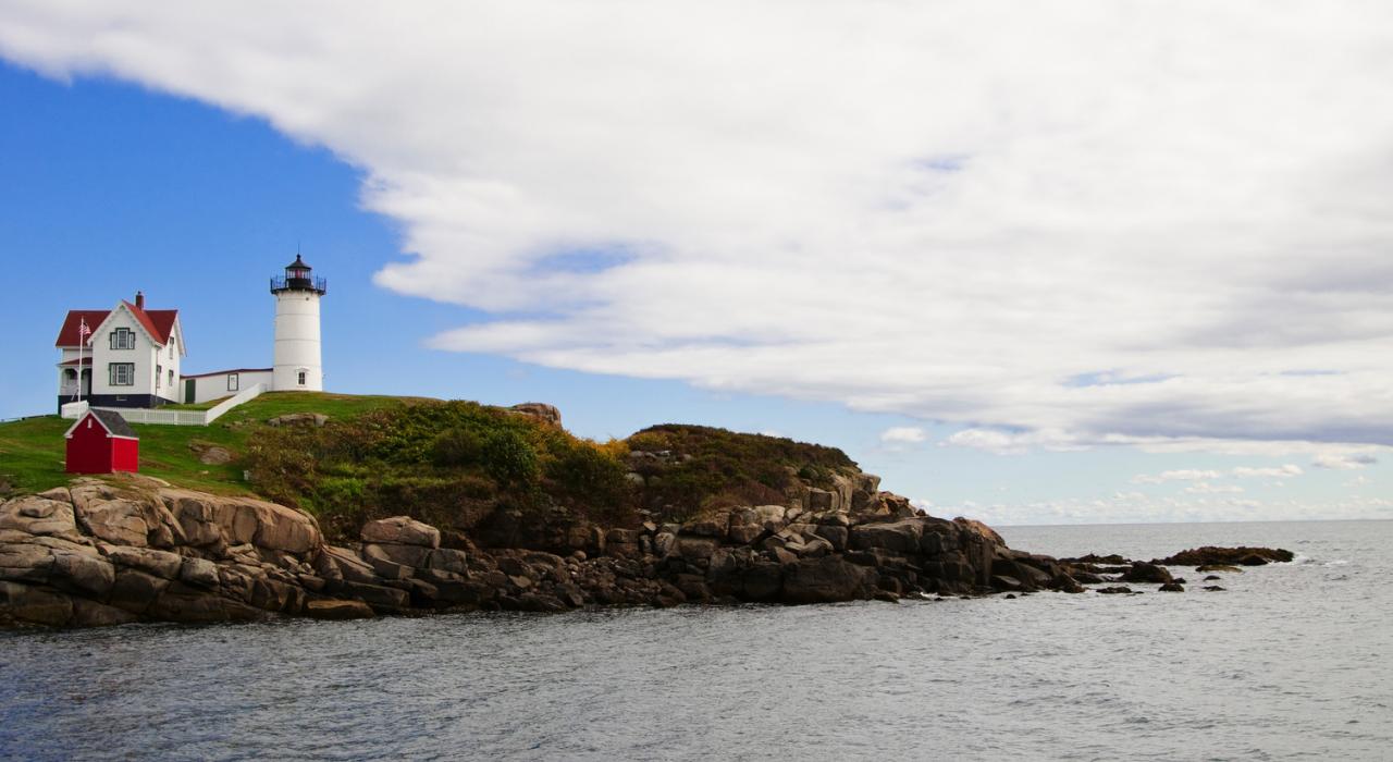 Cape Neddick Lighthouse in Maine on the rocky New England coast