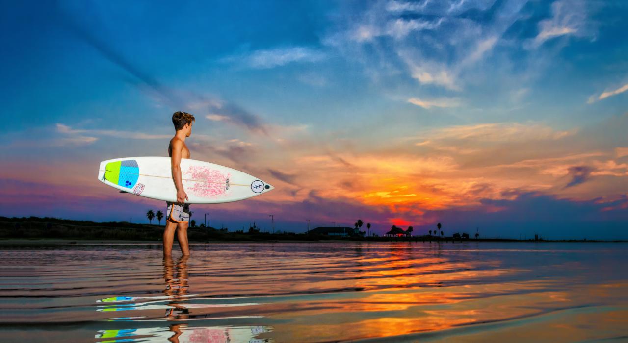 Surfing at sunrise in Brazosport, Texas