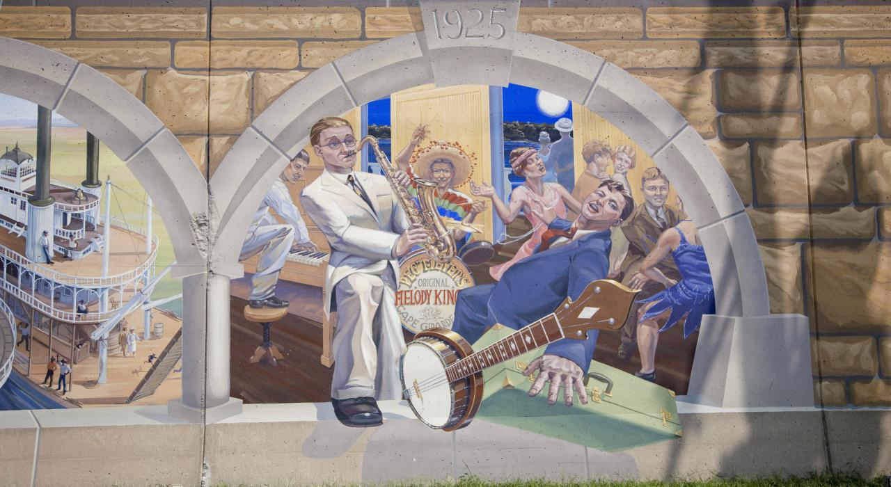 Close-up of the Mississippi River Tales mural on the downtown flood wall 