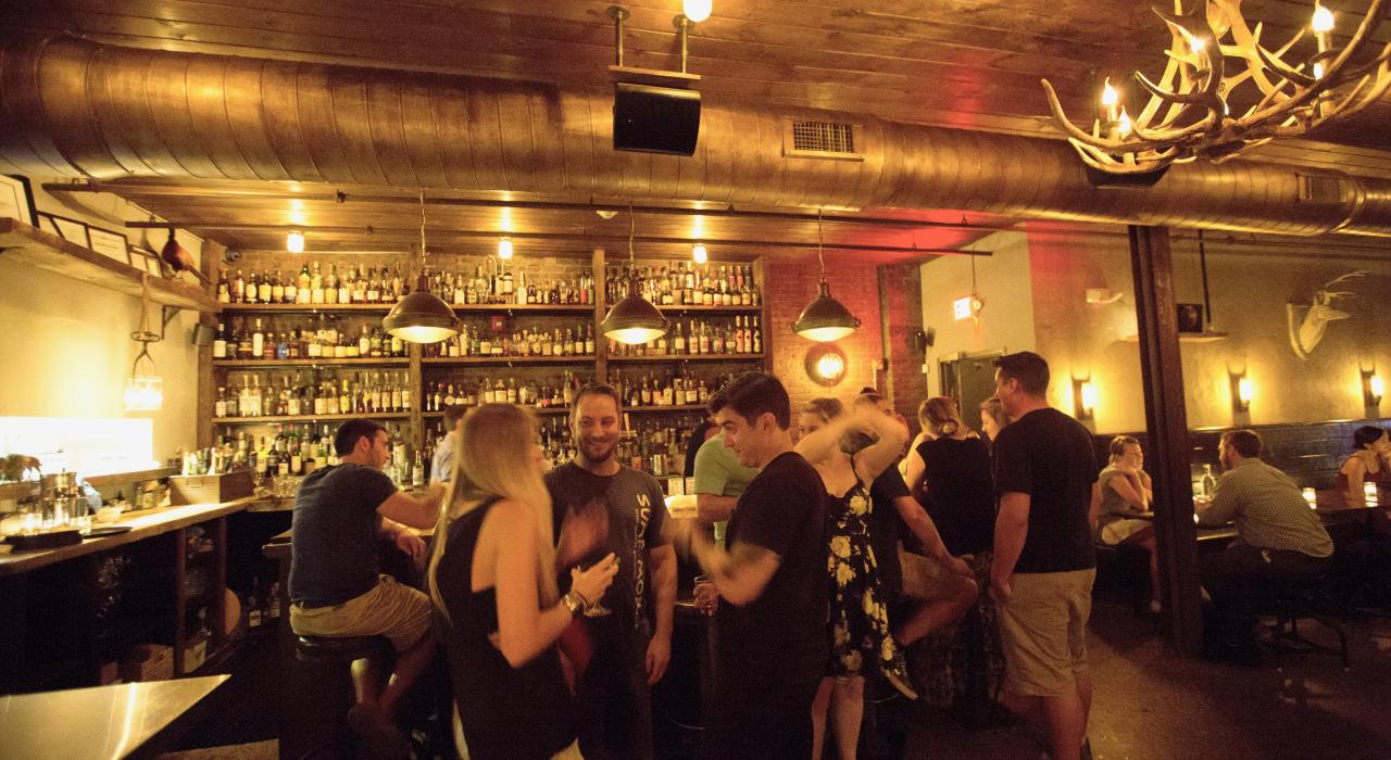 Drinks in a rustic-style gaming lodge at the Archer Bar in Jersey City, New Jersey