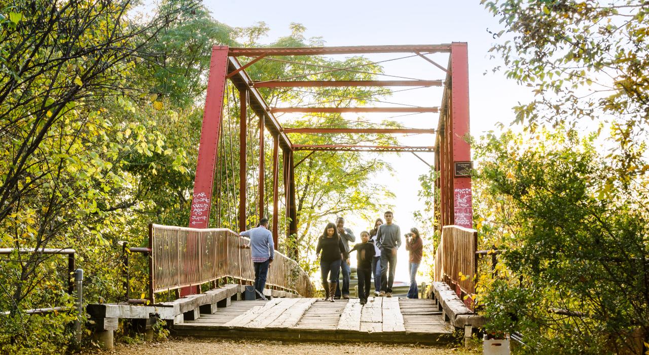 Strolling across the Old Alton Bridge, known as the Goatman's Bridge