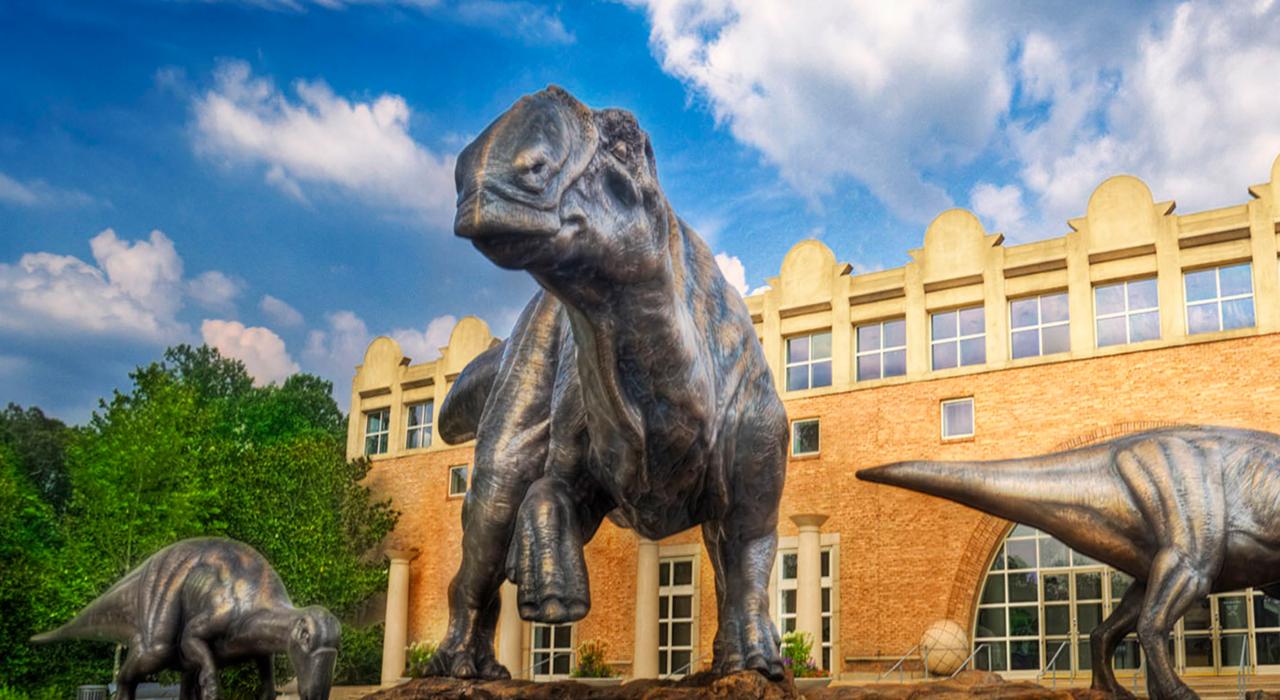 Bronze dinosaurs greet visitors at the Fernbank Museum of Natural History