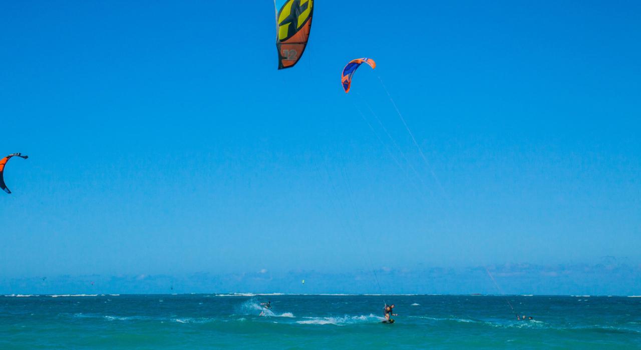 Kitesurfing across the vibrant blue waters of Ocean Park
