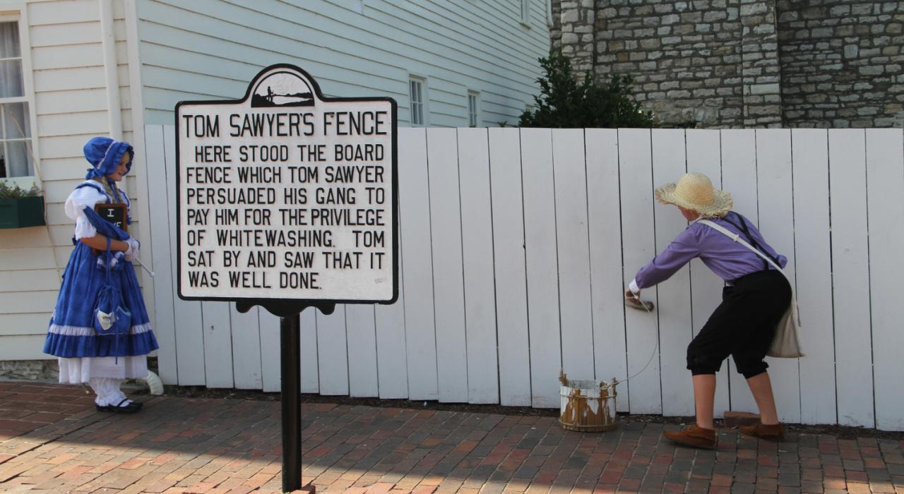Painting the fence in the backyard of Mark Twain’s Boyhood Home & Museum