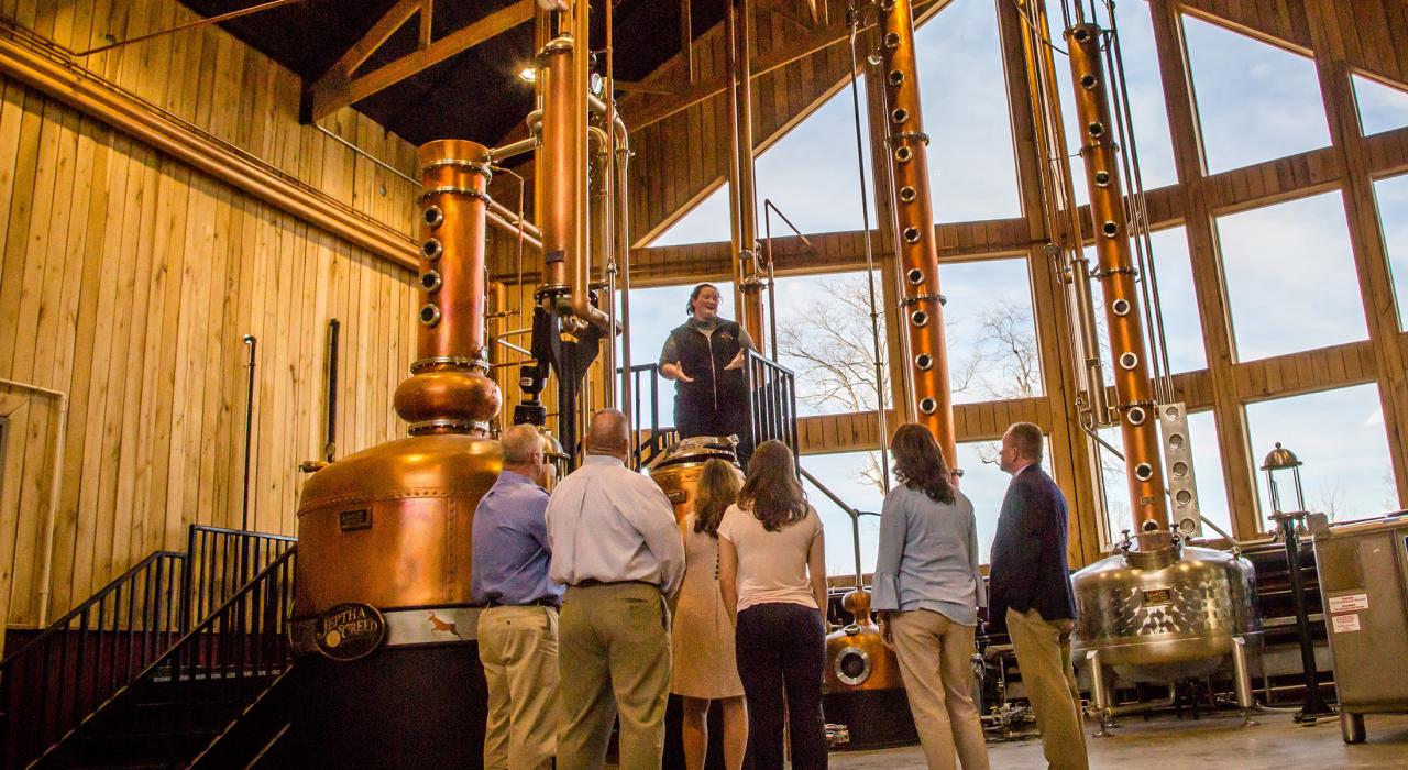 Learning about the distilling process on a tour at Jeptha Creed