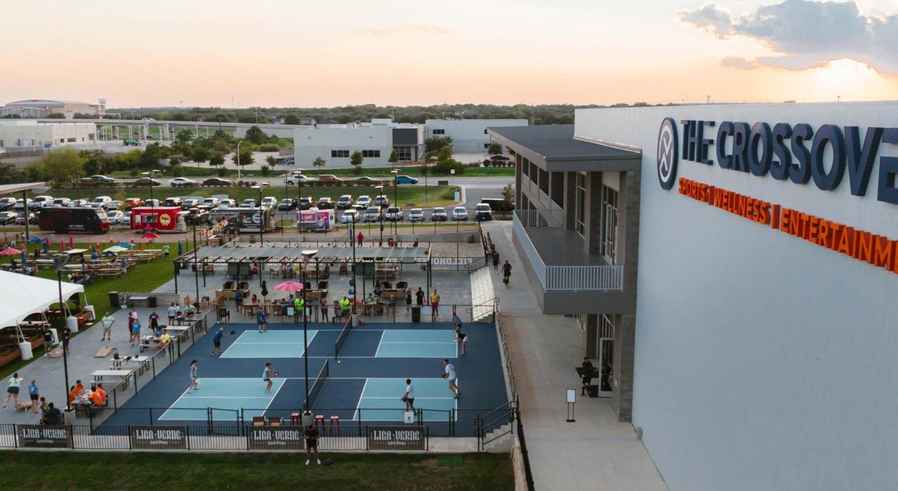 Pickleball and volleyball courts outside The Crossover, a sports, wellness and entertainment venue offering a vast range of activities